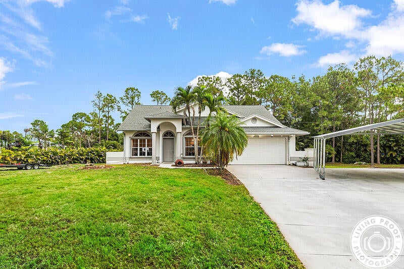 Photo of 4038 Calamondin Boulevard, The Acreage, FL 33470 (MLS # R11096783)