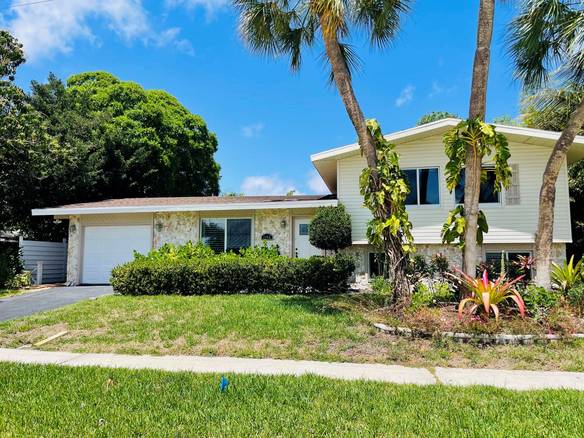 This exclusive 4 bed/ 2 bath home with a tropical oasis backyard with pool is everything you have been looking for. This home has 3 bedrooms upstairs and a master bedroom downstairs with a bathroom and an additional spacious room/den with sliding door to the backyard which can be used as an office. The home features fresh paint, new AC, impact windows with plantation shutters, washer and dryer, and much more! Located on a quiet street in a sought-after Boca Square neighborhood zoned for great Boca Schools including top rated Addison Mizner Elementary within 2 min. walk. In close proximity to Mizner Park, public beaches, restaurants, shopping, grocery stores and all that Boca has to offer! Schedule your showing today!Landlord pays pool and lawn maintenance. Pets ok with deposit.