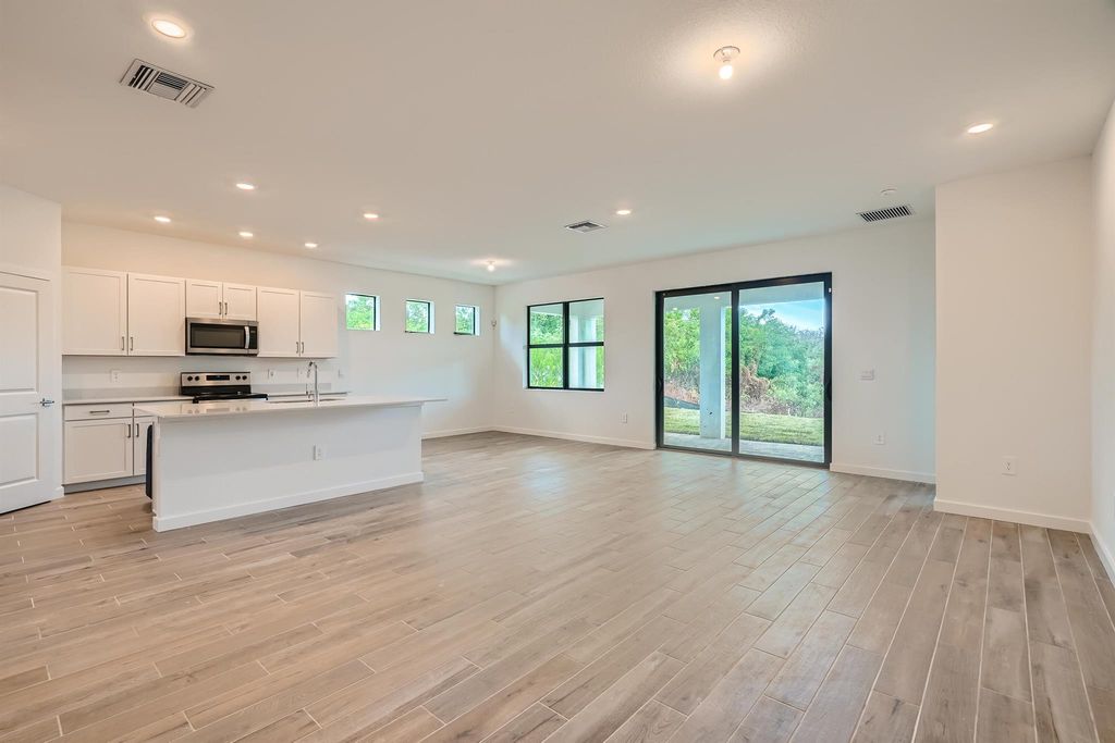 Photo of 5977 SE Skyblue Circle, Stuart, FL 34997 (MLS # R10948612)