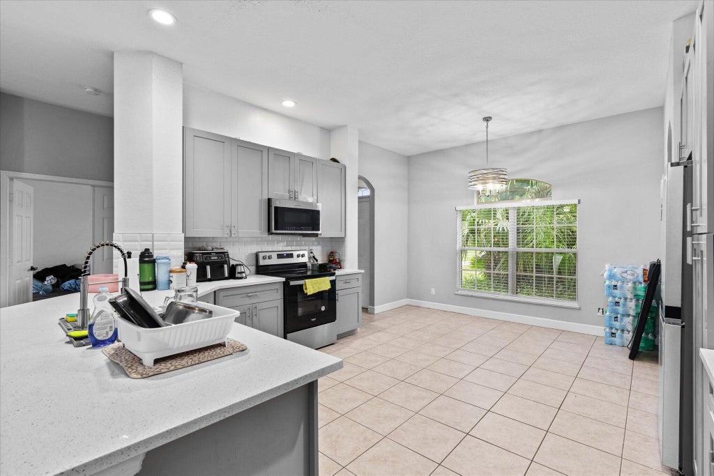 Photo of 849 SW Nichols Terrace, Port Saint Lucie, FL 34953 (MLS # B26034975)