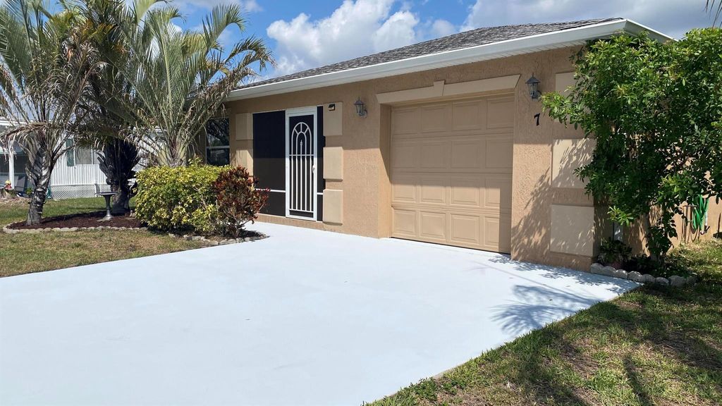 Photo of 7 Los Lagos Lane, Port Saint Lucie, FL 34952 (MLS # R11067789)