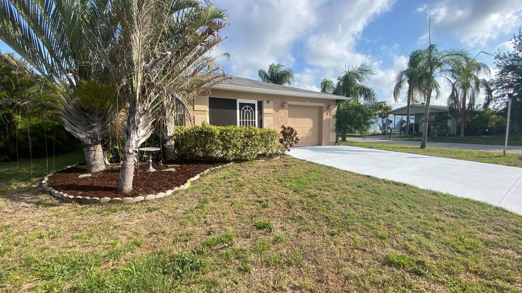 Photo of 7 Los Lagos Lane, Port Saint Lucie, FL 34952 (MLS # R11067789)