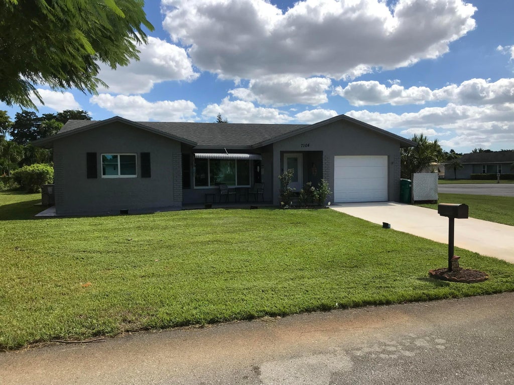 Photo of 7104 NW 92ND Terrace, Tamarac, FL 33321 (MLS # B26093648)