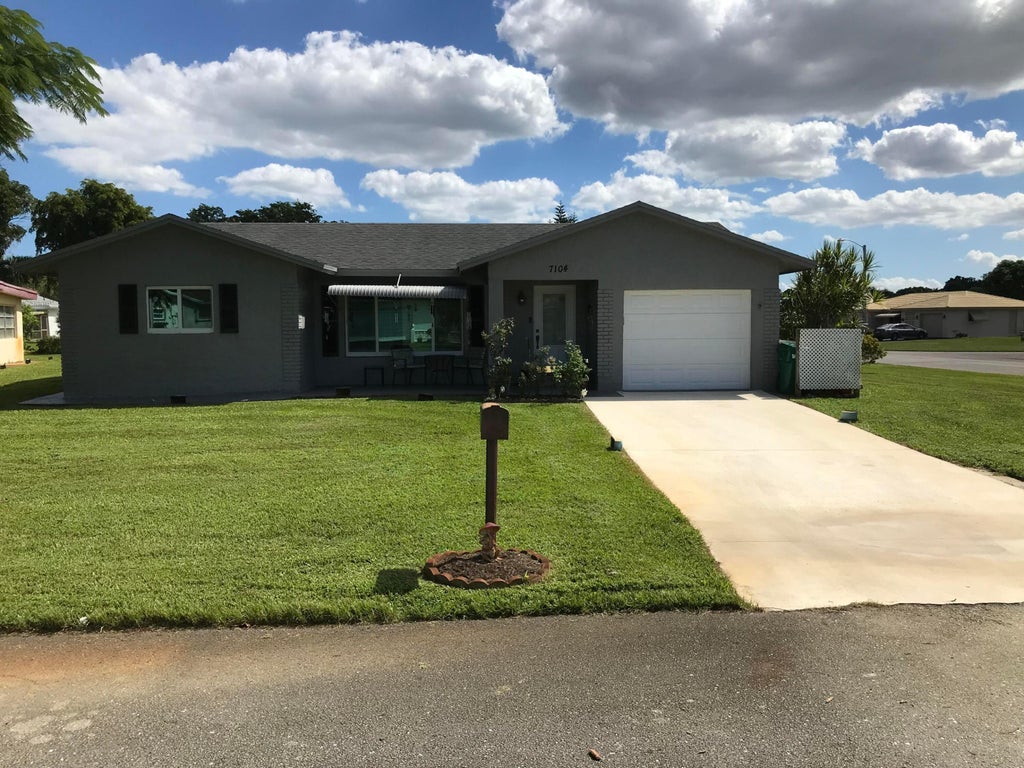 Photo of 7104 NW 92ND Terrace, Tamarac, FL 33321 (MLS # B26093648)