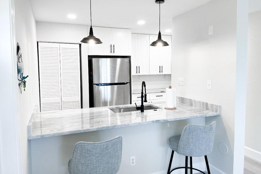 Bright and fully furnished 2-bedroom, 2-bathroom condo nestled in the Beach Villas community. Situated conveniently on the first floor, with a designated parking spot underneath, accessibility is a breeze. Step into comfort and convenience as you enter the condo- every detail has been meticulously arranged to ensure a relaxed atmosphere. From the fully equipped kitchen to the washer/dryer unit, everything you need is at your fingertips. Enjoy breathtaking views and soak in the warm ocean breezes from your private balcony, offering a perfect spot to unwind after a long day. With the beach just steps away and the Fort Pierce inlet a mere mile to the north, outdoor adventures await. The condo is conveniently located close to downtown, shopping centers, and an array of dining options.