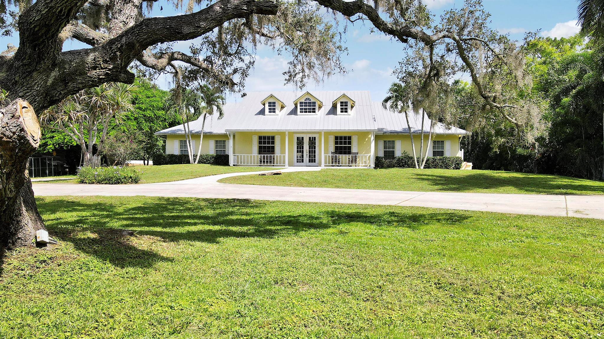 Rare to market 4 bedroom CBS home on nearly 2 acres of fully fenced property in the heart of Stuart! Fully remodeled and open kitchen to family room with triple split floor plan. New AC, plantation shutters, vaulted ceilings, spacious enclosed patio (with AC) and plenty of room for a pool, boat, RV, chicken coop and more! Impact windows throughout and a second electrical panel for power loss with generator. Private, quiet lot, yet close proximity to all major roadways. Ability to operate business from home as this can also be utilized as a mixed used property.