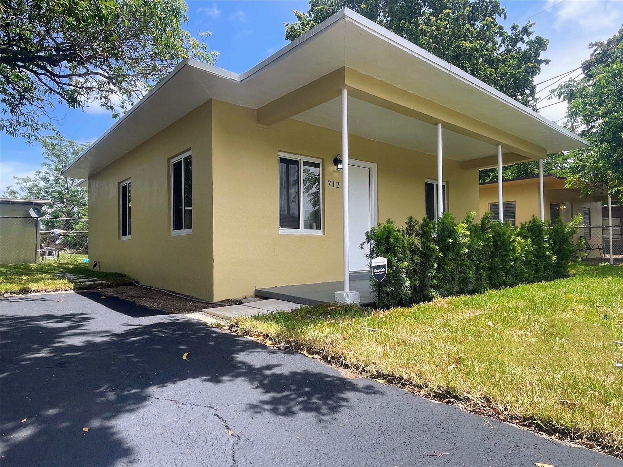 Beautifully updated CBS home in the heart of Fort Lauderdale's Lincoln Park. This 2-bed, 1-bath home is tucked away on a quiet street and has been tastefully redone throughout. Enjoy an updated kitchen, bathroom, flooring, and central A/C. The home features impact windows, a new roof from 2024, and fresh interior/exterior paint. Relax on the front or back porch, which includes washer/dryer hookups. The newly sodded fenced in yard is perfect for entertaining, gardening, parking a boat, and soaking up the South Florida sunshine. Just minutes from shopping, dining, schools, major redevelopments, and downtown Fort Lauderdale. READ BROKER REMARKS