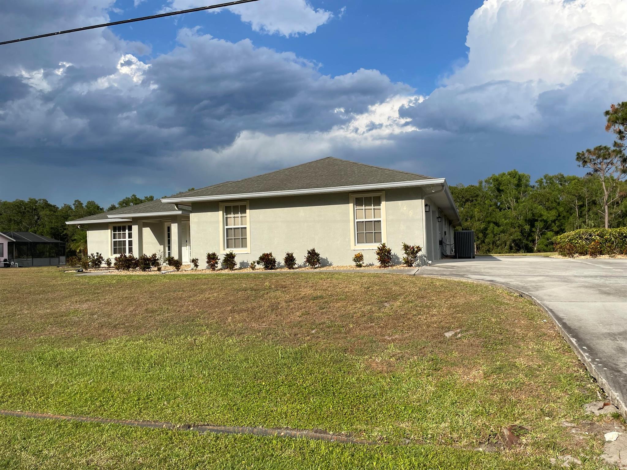Beautiful Large Lake Front 4/3/2 Home in Paar Estates. Over 2800 sqft under air. This home has a mother in law suite with its own full bathroom. Split Bedrooms, Kitchen Island lots of Cabinet Storage. Extra Parking Pad for Boat or RV. This home is perfect for a large family. On oversized lot.