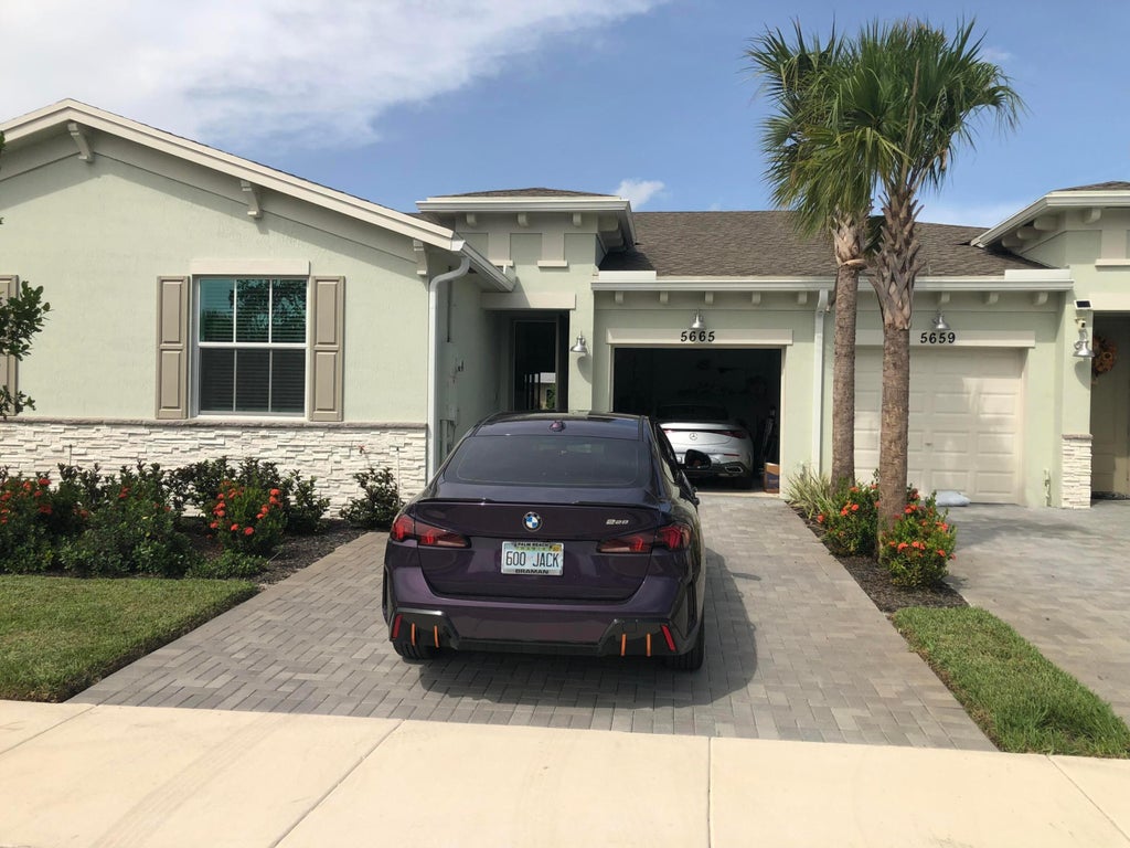 Photo of 5665 DIVINE Drive, Delray Beach, FL 33484 (MLS # B26080120)