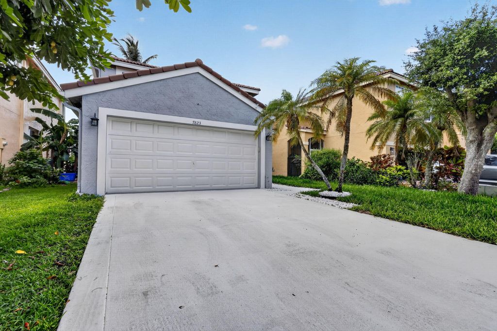 Photo of 7823 Springfield Lake Drive, Lake Worth, FL 33467 (MLS # B26041086)