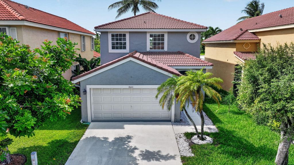 Photo of 7823 Springfield Lake Drive, Lake Worth, FL 33467 (MLS # B26041086)