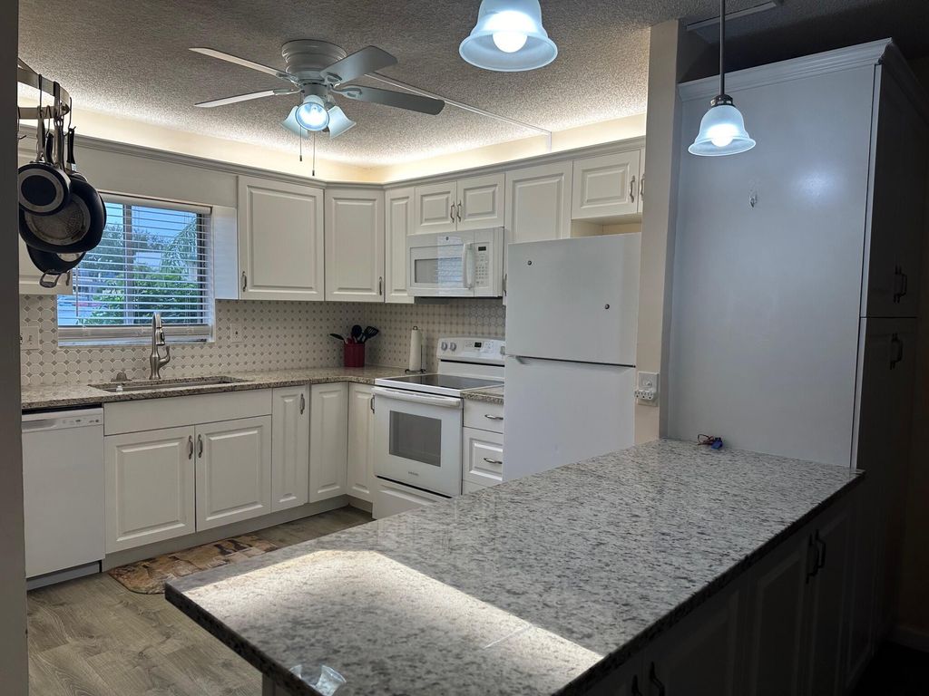 Photo of 1350 NE 14th Court #J25, Jensen Beach, FL 34957 (MLS # R10948118)
