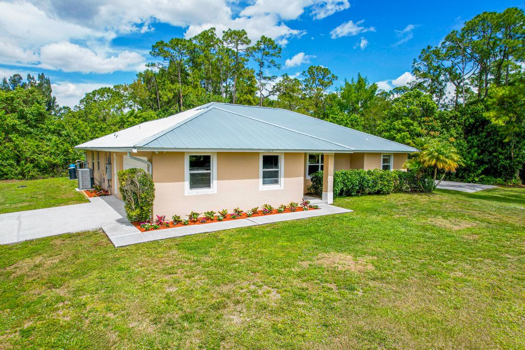Photo of 15829 133rd Terrace N, Jupiter, FL 33478 (MLS # R10954623)