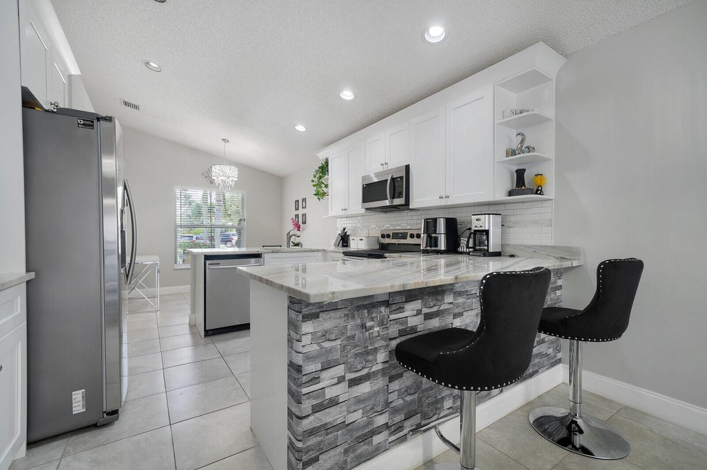 Photo of 6376 Barton Creek Circle, Lake Worth, FL 33463 (MLS # B26069283)