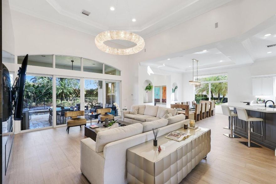 Situated within the gated enclave of Azura, 17334 Pavaroso Street delivers refined design, thoughtful upgrades, and resort-style living in one exceptional residence. Spanning over 5,200 square feet, this five-bedroom estate offers a bright, open layout highlighted by custom finishes, statement lighting, and elegant porcelain flooring throughout the main level as well as a beautifully designed chef's kitchen that anchors the home with both style and performance. Recently redesigned, it showcases contrasting custom cabinetry, a multi-level island encapsulated with sleek Bianco quartz surfaces which offers generous prep and seating space. The appliance collection is truly top-tier, highlighted by a 60'' Wolf gas range with six burners, a 24'' griddle, double ovens, and a custom hood. The kitchen also features multiple Wolf specialty ovens, including a third electric oven, microwave drawer, warming oven, and steamer. A premium Subzero refrigeration system with dedicated refrigerator and freezer drawers is paired with a Monogram dishwasher. Designed with hosting in mind, the space is complete with a wine cooler, beverage refrigerator, and built-in ice maker. Every element has been carefully selected to deliver professional-grade performance with effortless elegance, equally suited for everyday living and elevated hosting. The primary suite is privately positioned on the first floor, offering peaceful pool views, dual custom closets, and a spa-inspired bath designed for relaxation. A versatile ensuite office or guest room completes the main level. Upstairs, three additional ensuite bedrooms and two spacious lofts provide flexible living, work, or recreation opportunities. Outdoors, the property becomes a private retreat with a resort-style pool and spa, covered lounge areas, and a fully equipped summer kitchenideal for year-round enjoyment. Additional highlights include full impact glass, a whole-home generator, and a three-car garage. Residents of Azura enjoy access to resort amenities including a clubhouse, fitness center, tennis courts, and pool, all just minutes from Boca Raton's top schools, dining, and Town Center at Boca Raton shopping. This home presents a rare opportunity to experience luxury, comfort, and lifestyle in one of Boca Raton's most desirable exclusive communities.

DISCLAIMER: Information published or otherwise provided by the listing company and its representatives, including but not limited to prices, measurements, square footages, lot sizes, calculations, statistics, and videos, is deemed reliable but is not guaranteed and is subject to errors, omissions, or changes without notice. All such information should be independently verified by any prospective purchaser or seller. Parties should perform their own due diligence prior to a sale or listing. The listing company expressly disclaims any warranty or representation regarding such information. Prices published reflect list price, sold price, and/or last asking price. The listing company participates in the Multiple Listing Service and IDX.