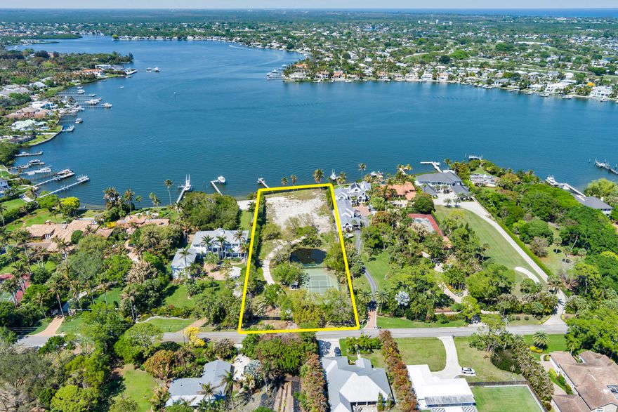 Prime building site on the Loxahatchee River in Jupiter's premier neighborhood, Pennock Point. Spanning 1.9 acres with 165 feet of river frontage and approximately 540 feet of depth, this exceptional property presents a rare opportunity to create a custom waterfront estate. Enjoy direct boating access with less than a 5-minute ride to waterfront dining and premier offshore fishing. Existing improvements include a regulation tennis court with cabana, a tranquil pond and a private dock. Amazing opportunity to build your dream waterfront estate.