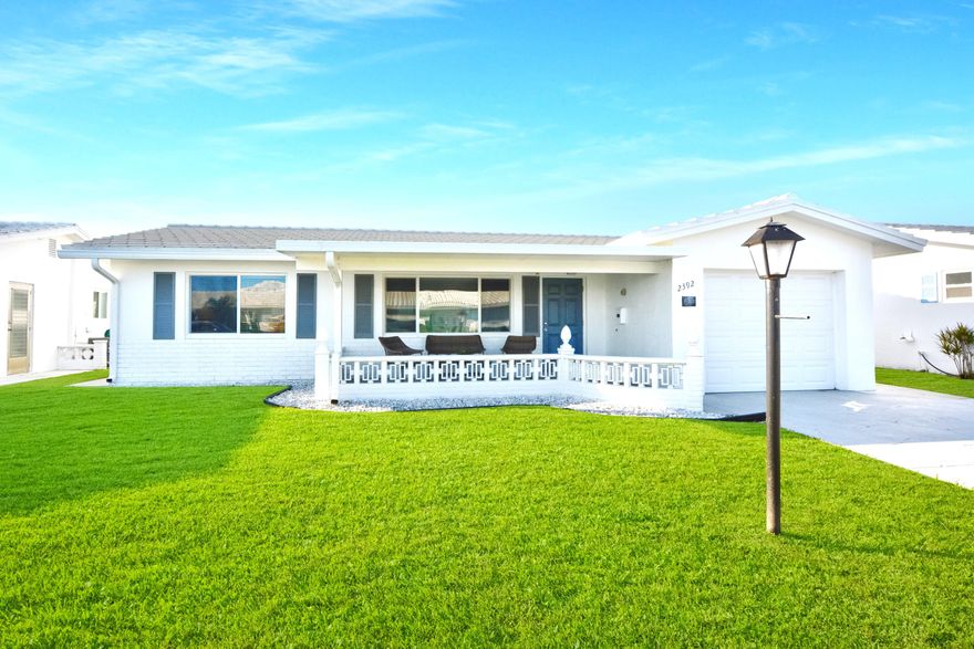 Totally updated Edgewood Model with full Florida room.  Paid up recreation lease in full.
Thousands in upgrades including HURRICANE IMPACT WINDOWS, ROOF REPLACEMENT 2019, ELECTRICAL PANEL CHANGE-OUT  2015, HURRICANE RATED GARAGE DOOR 2015, AC 2016.  Double concrete drive plus front porch with insulated roof.  Kitchen cabinetry all replaced plus updated appliances. Quartz countertops. Both baths redone.  Neutral tile on the diagonal throughout.  Popcorn ceiling removed and knockdown texture added plus crown molding. Custom window treatments. Disappearing screen door at entry way. Owner will consider selling furnishings separate.  A MUST SEE.  FREE GOLF, 3 CLUBHOUSES & 3 HEATED POOLS, MINUTES TO OCEAN BEACHES AND SHOPPING..