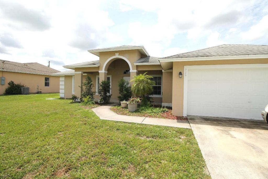 Photo of 926 SW Hamberland Avenue, Port Saint Lucie, FL 34953 (MLS # R10984210)