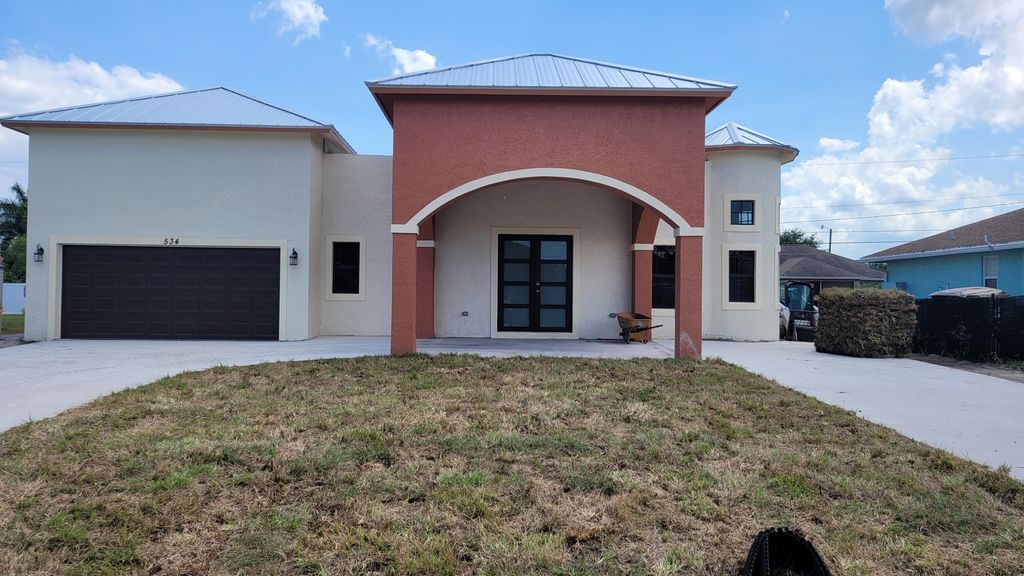 Photo of 534 SW Paar Drive, Port Saint Lucie, FL 34953 (MLS # R10800204)