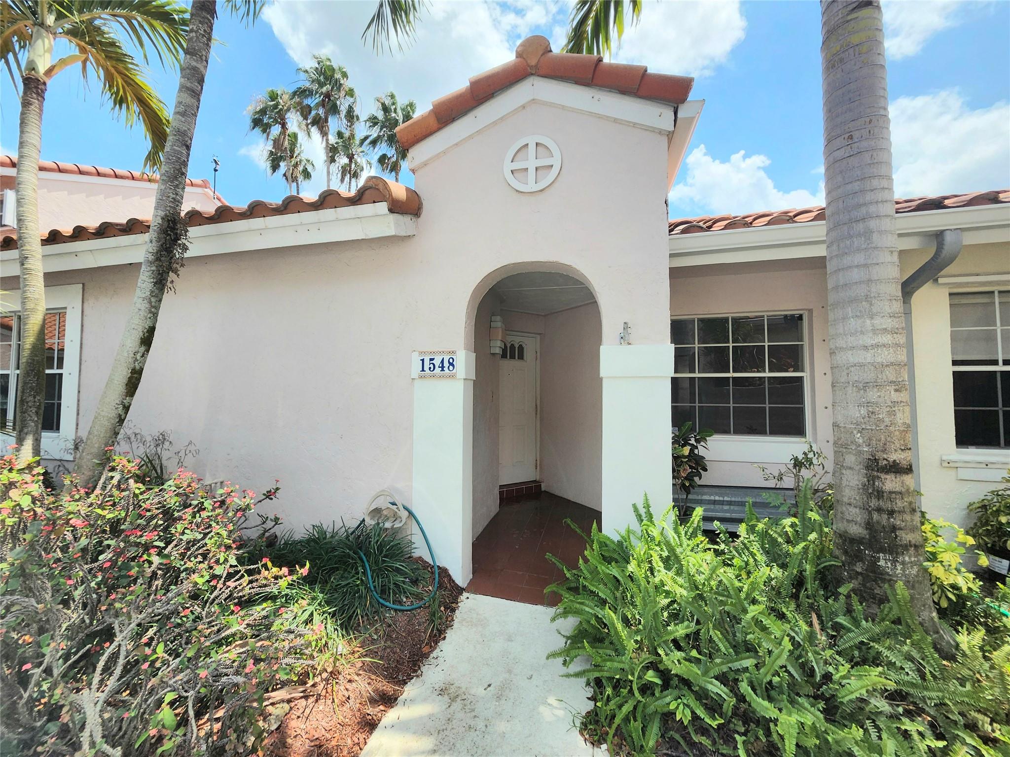 Feel the peace and serenity as you walk into your bright and freshly painted townhome with new porcelain tile flooring, new carpet in bedrooms and updated vanity in the main bathroom. The Kitchen has new cabinetry and overlooks the large terrace facing the lake with plenty of space for relaxation. With a covered patio outside the living room, imagine reading a book while watching an afternoon storm. The living room, dining room and kitchen all have sliding glass doors accessing the terrace for an easy flow into the open living and dining area for great entertaining. With beautiful upgrades, a brand new HVAC and a serene terrace lake view, this home is ready for you to move right in.