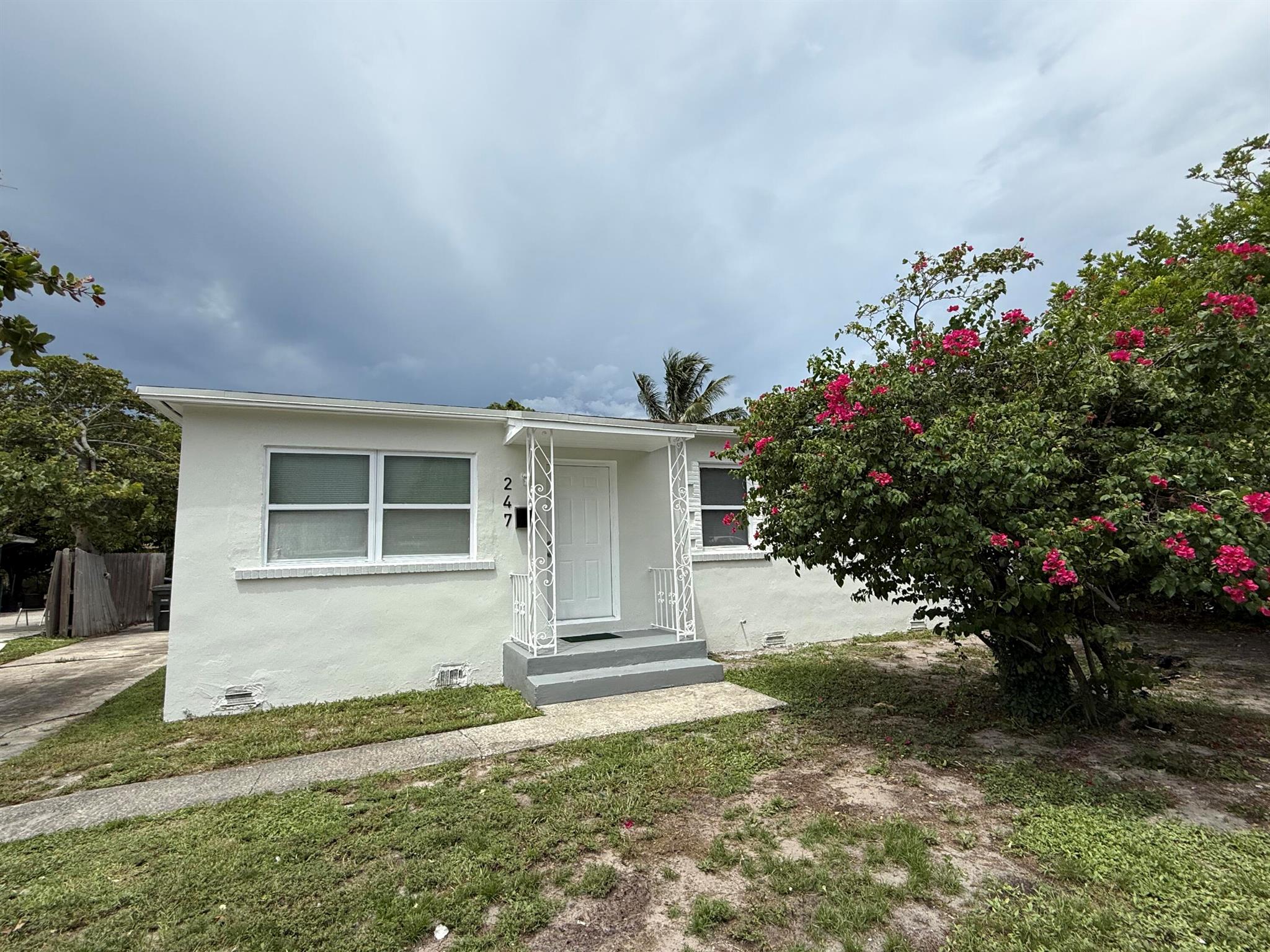 Charming and move-in ready 3-bed, 1-bath home ideally located just minutes from the intracoastal, beaches, shopping, and dining. This property features a spacious yard with room for a boat or a large vehicle. This home makes an excellent primary residence, seasonal retreat, or investment property. It offers flexible development potential for duplexes, triplexes, or other multi-unit housing. The R-2 zoning allows for maximizing rental income or expanding housing options, making this a rare find in one of Palm Beach County's most up-and-coming neighborhoods!