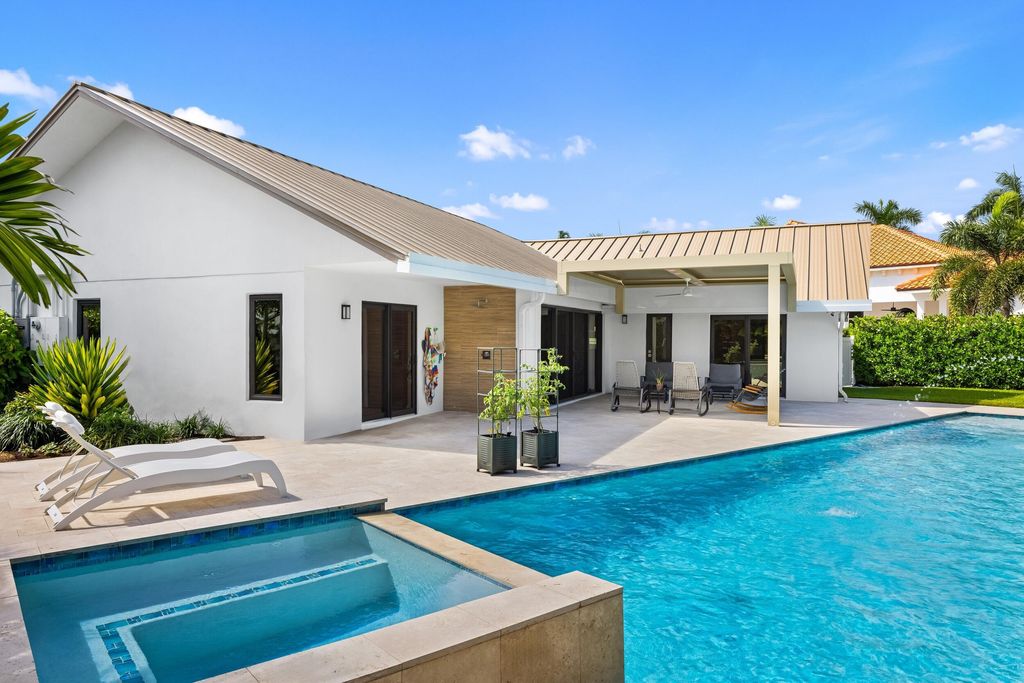 Photo of 843 NE Mulberry Drive, Boca Raton, FL 33487 (MLS # B26012639)