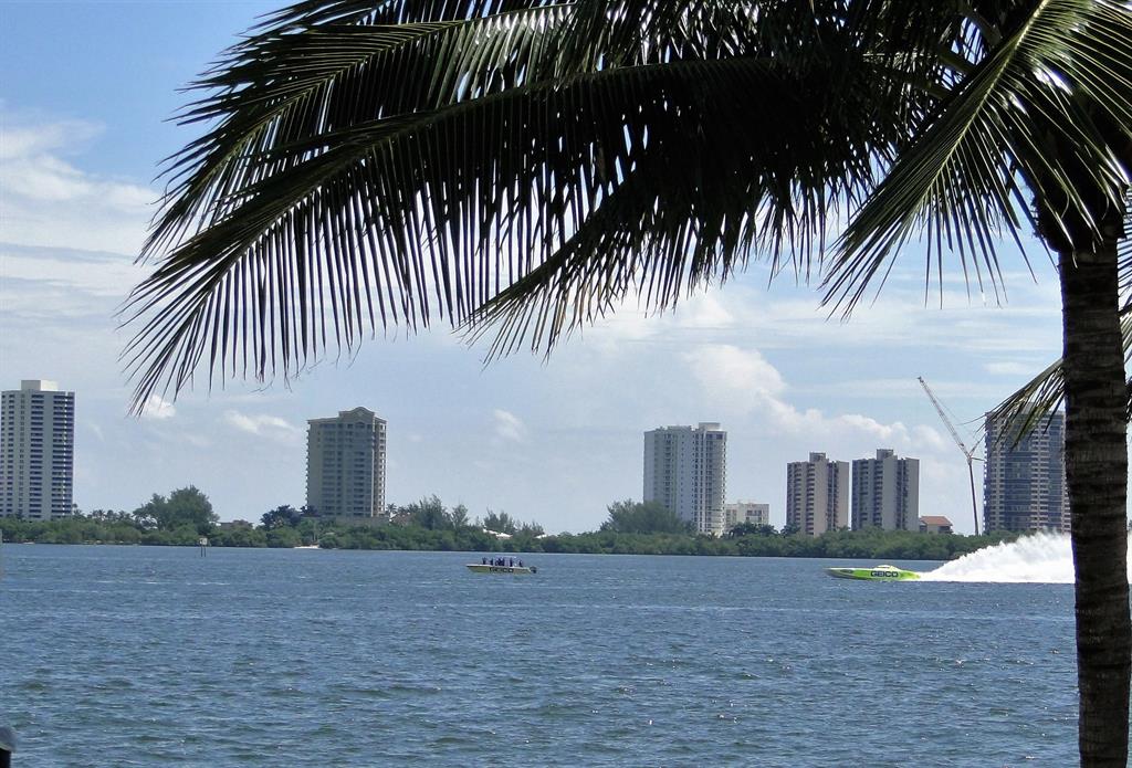 Perfect ground floor corner unit with french door & sliders leading to the open patio directly on deep water canal. Watch the boats go by from your living room! Only a few units in this complex have this view. Updated with granite kitchen & bathroom countertops, large breakfast bar, tile on a diagonal throughout, bright living room / dining room featuring extra (end unit) windows. Split bedroom floorplan for added privacy. Bay Reach is a beautiful gated waterfront community on the Intracoastal waterway with boat docks available for lease. Clubhouse, gym, outdoor kitchen & seating, resort style pool & jacuzzi, tanning beach, and fitness center. Close to shopping, beaches, restaurants, Cityplace and PBI airport. Includes water and basic cable.