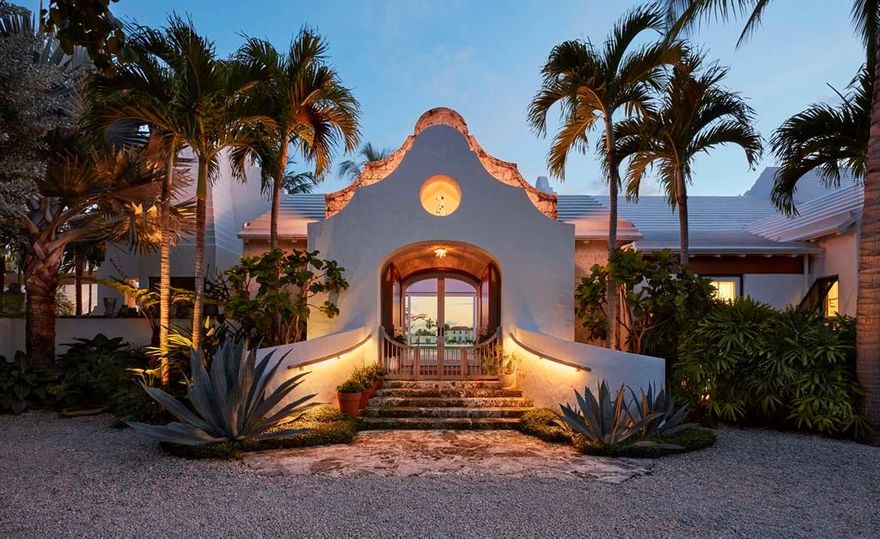 Authentic Bermudian-style house with 232' of rare south facing Intracoastal frontage and golf course views. Built for entertaining, the house won the 2017 Schuler Award from the Preservation Foundation for outstanding new architecture, as well as an AIA award for excellence in design. The large master suite incorporates a dressing room and two spa quality bathrooms as well as a sitting room and fully equipped gym. The property features a whole house generator, garage space for five cars, full smart home technology, a water purification system, retractable glass walls, lush mature landscaping and numerous other highly detailed architectural touches that make this spectacular home truly unique.