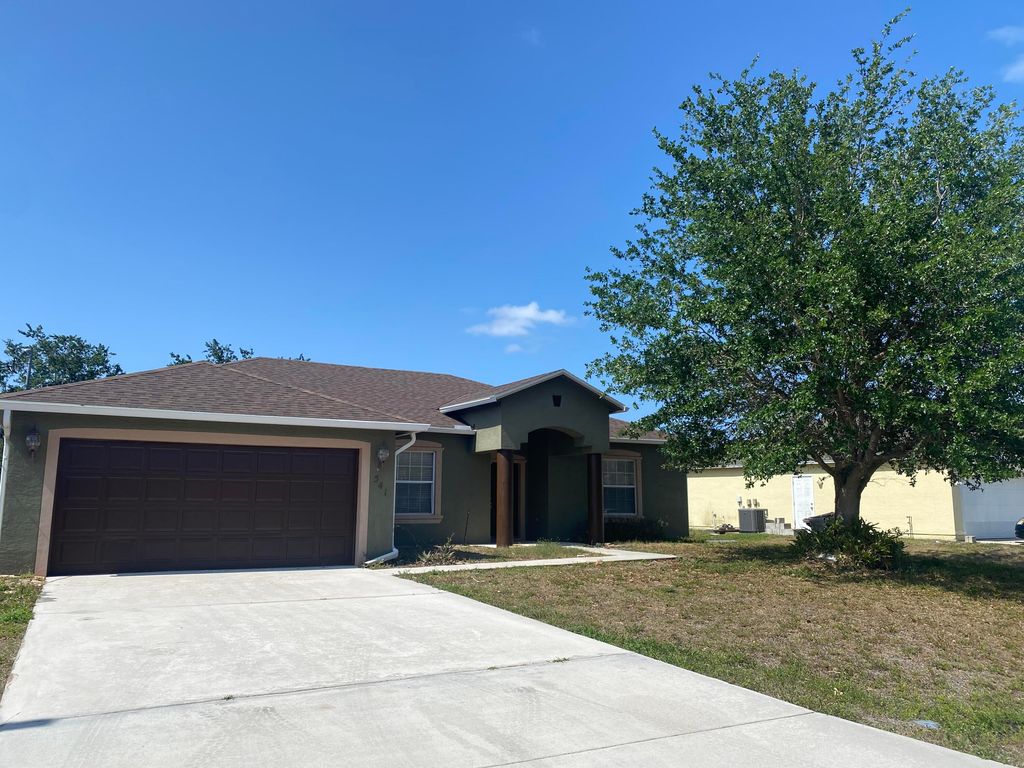 Photo of 541 SW Halkell Avenue, Port Saint Lucie, FL 34953 (MLS # R10799284)
