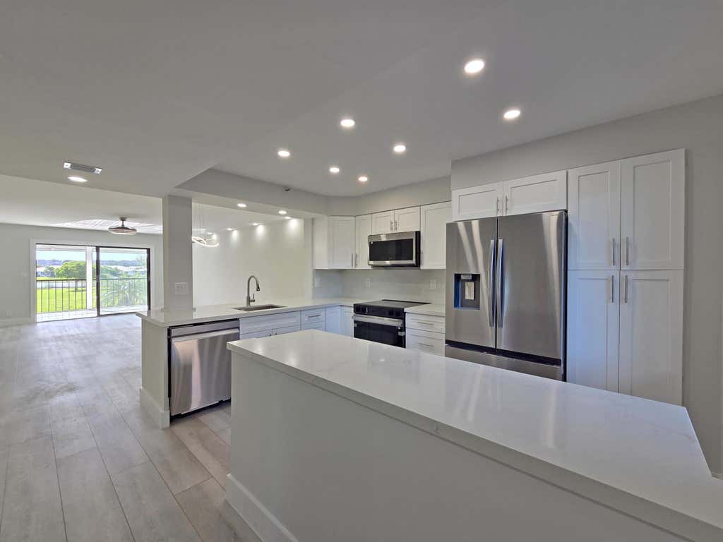 Photo of 14426 Amberly Lane #203, Delray Beach, FL 33446 (MLS # B26051390)