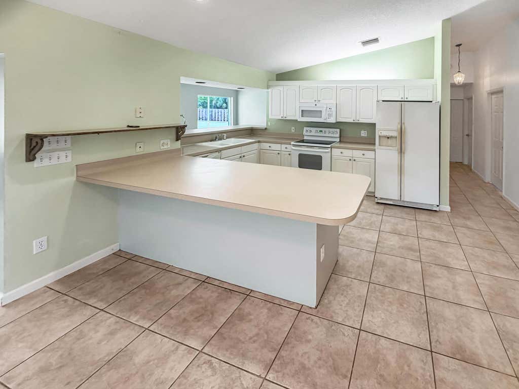 Photo of 2361 NE 21st Avenue, Jensen Beach, FL 34957 (MLS # B26049706)