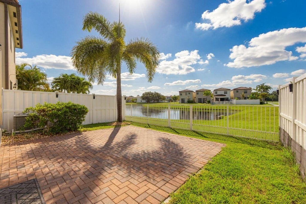 Photo of 3002 Butternut Lane, Riviera Beach, FL 33410 (MLS # B26071031)