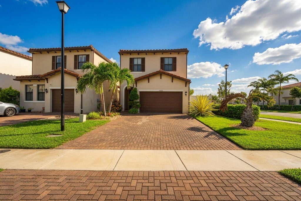 Photo of 3002 Butternut Lane, Riviera Beach, FL 33410 (MLS # B26071031)