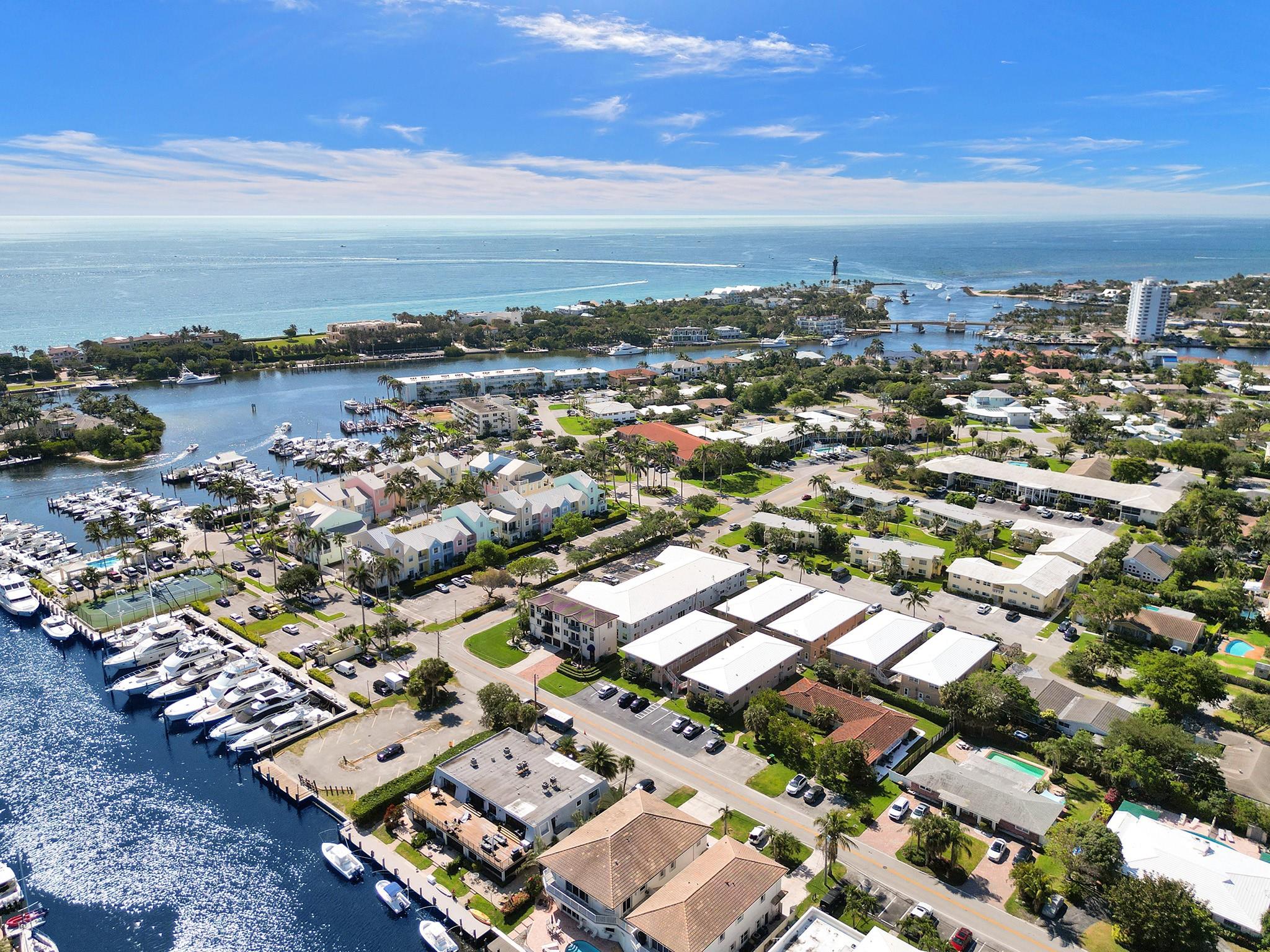 Rarely available is this first floor 2 bedroom, 2 bath condominium in the trendy marina area of Lighthouse Point. This first floor, corner unit is conveniently located to the Nauti Dawg and Caps Place restaurants. The large kitchen is updated with white cabinets, granite counter tops, dishwasher, stove, refrigerator and newer washer/dryer. Open to the spacious living room with lots of natural light. Split bedroom plan, 2 bathrooms, plenty of storage and freshly painted. Tile floors throughout, central A/C and impact windows. Courtyard views and assigned parking. Pet friendly building.