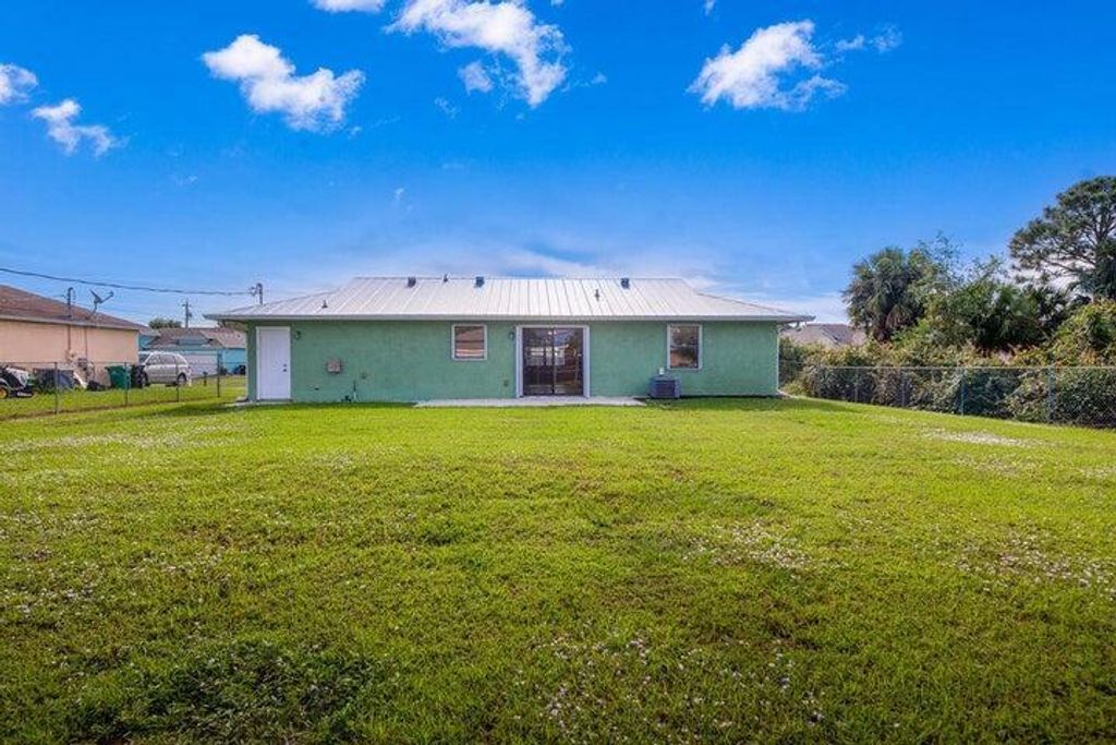 Photo of 1011 SW John Maccormack Terrace, Port Saint Lucie, FL 34953 (MLS # R10971425)