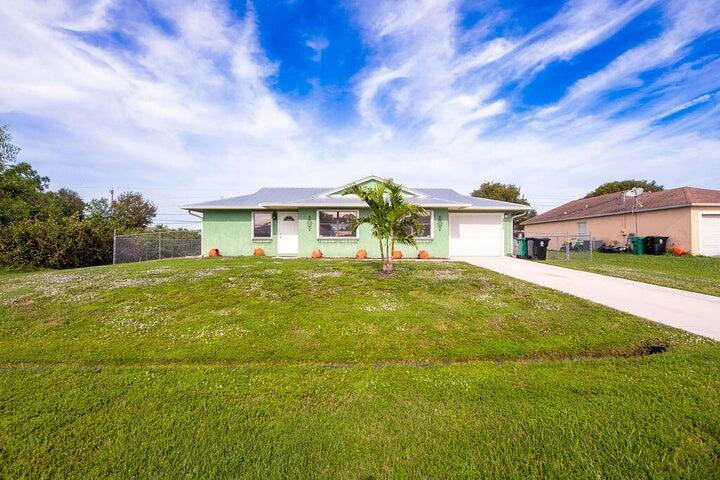 Welcome to this charming 3-bedroom, 2-bathroom home with an inviting open floor plan. The property is in excellent condition, boasting a sleek design with tile flooring throughout, providing both durability and a seamless aesthetic. Perfect for any family this residence offers a turnkey opportunity. The metal roof, installed in 2018, ensures structural integrity and peace of mind for years to come, along with accordion shutters throughout the home. The property sits on a generous lot, providing ample space for various outdoor activities, storage, and the potential addition of a refreshing pool. Quiet location on Oak Hammock community with easy access to Crosstown and Port Saint Lucie Blvd and few blocks away from Oak Hammock Elementary School. Don't miss this ready to move home!