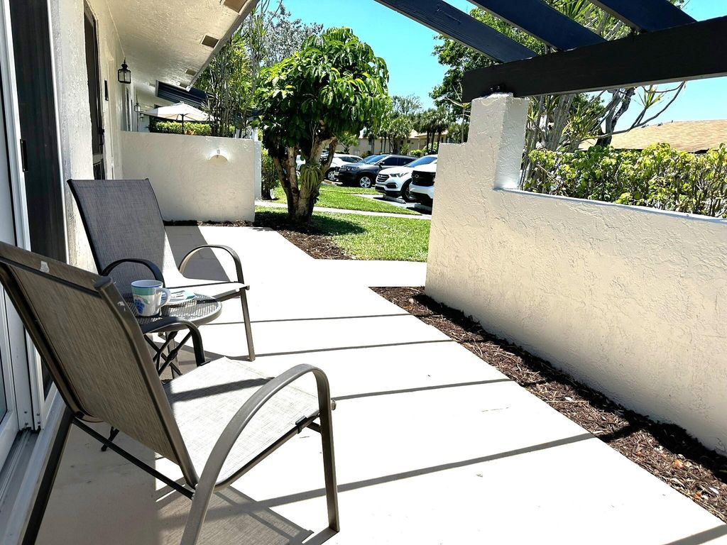 Photo of 5750 Princess Palm Ct #Unit A, Delray Beach, FL 33484 (MLS # R10983584)