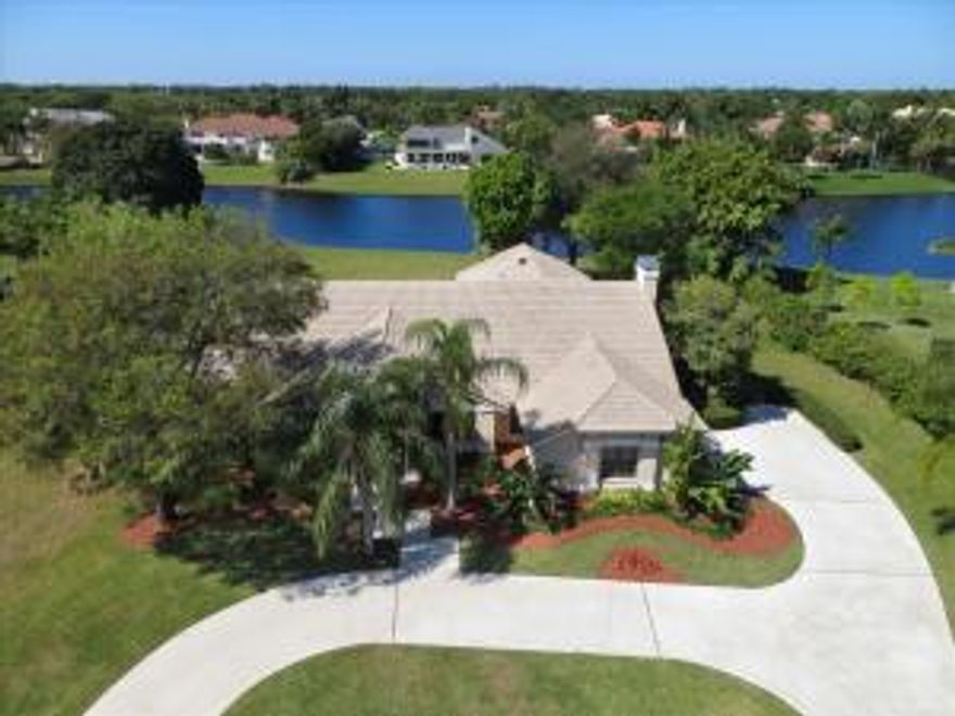 Premium lakefront one acre estate lot, 4 bed, 3 baths plus den and billiard room.  Large family room with fireplace and wet-bar. Updated kitchen and newer roof. Over 4,200 +/- square feet under air, 5,300 +/- total square feet.  186 feet of lake frontage.A prime lakefront setting in the intimate enclave of Fieldbrook Estates highlights this distinctive residence opening to a beautiful pool patio on sweeping lakeside lawns.Offering an exceptional experience of estate living, Fieldbrook Estates is an intimate gated community of just 54 one-acre properties centered on a shimmering 14+/--acre lake in a lush tropical oasis set behind a gated entry.