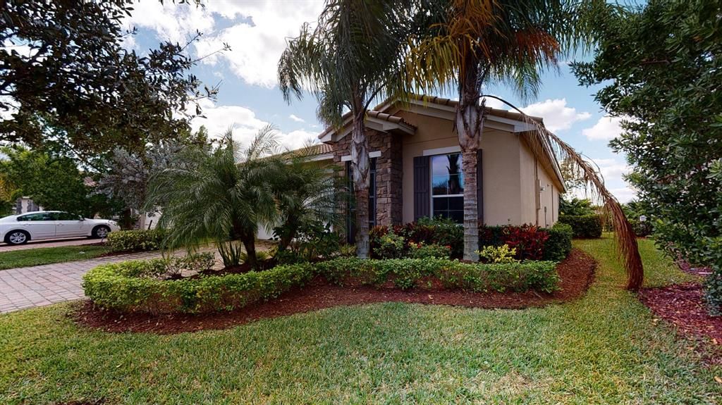 Photo of 9715 SW Royal Poinciana Drive, Port Saint Lucie, FL 34987 (MLS # R10680498)