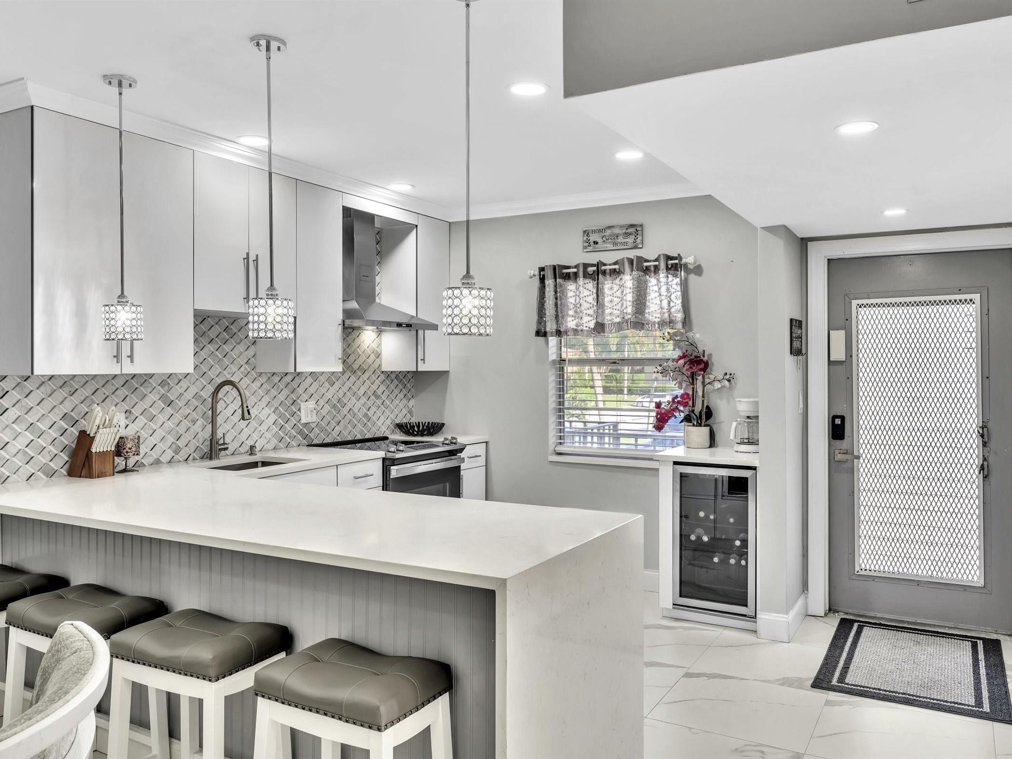 Rockstar Beautiful describes this Immaculate Modern Open Concept Design in the sought after Neighborhood of Oriole Gardens 3 ! A 55+ Community. This home has been Professionally Remodel with every attention to detail. Used as a Vacation Home this home is Brand New and Beautiful.
Additional Perks: "On-Site Laundry" and "Large Storage Locker," conveniently located just steps from your front door! Conveniently located with Coral Square Mall just down the Road, Publix Grocery around the block. See attachments in the MLS.
Homes like this rarely come on the Market, Don't Wait, call Today!