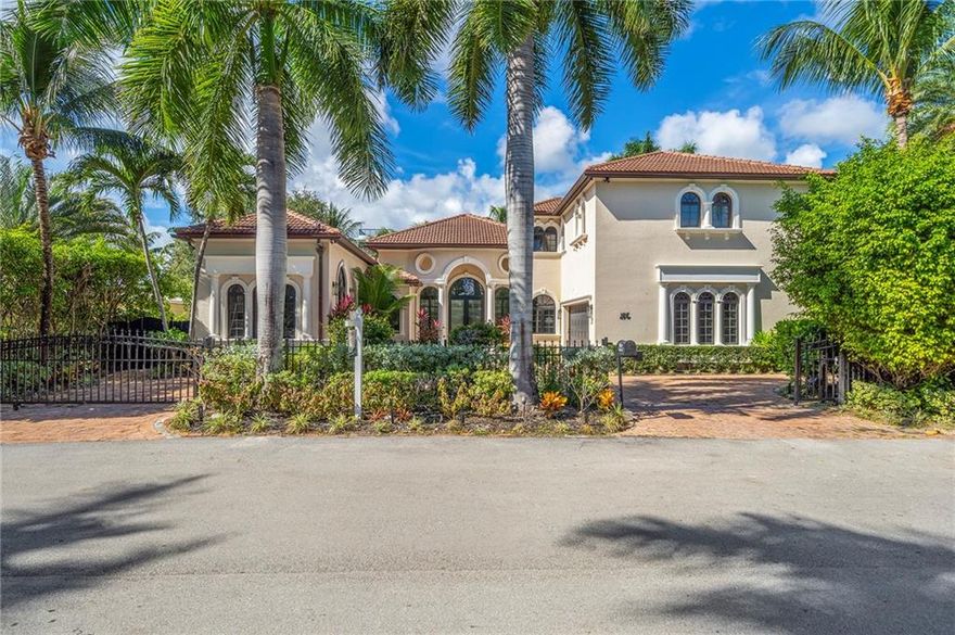 Waterfront Gated Estate in heart of Fort Lauderdale, Las Olas Isles, Elegant Mediterranean-Contemporarily refreshed, features exceptional Great Room with volume ceilings, architectural detail with light filled warm ambiance and, great layout with 3+1 beds on first floor and 3 beds on 2nd. Marble and wood floors, granite countertops, chef's kitchen with Sub-Zero Fridge and Wolf gas range open to family room. Primary Suite on 1st floor with expansive walk in closet and bath, separate entrance for Guest/In-Law Suite or Maids Quarters, UG propane tank, Gas Generator, 6.5 baths (5 ensuite), One bed used as Office/Guest Suites' sitting area. Stunning heated salt water pool, 2 Car Garage, 80 Ft dock. Vacation Rental Ready.