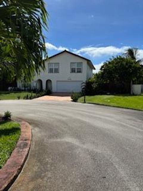 Photo of 6785 Escondida Drive, Lake Clarke Shores, FL 33406 (MLS # R11128263)