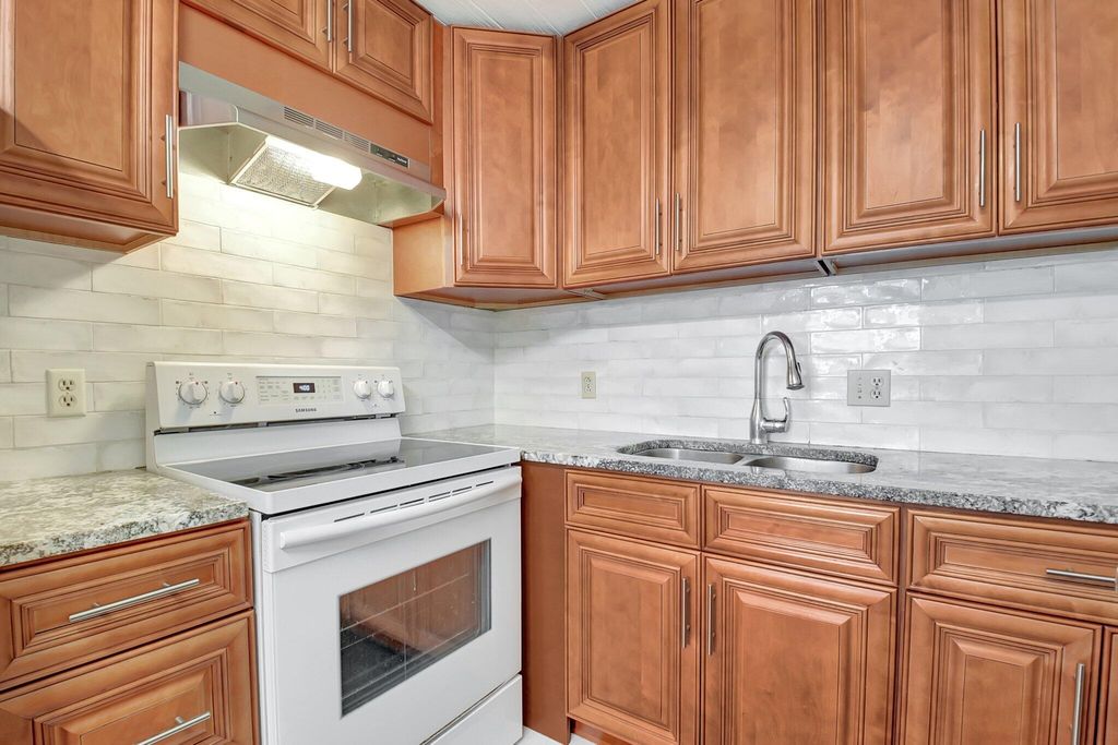 Photo of 400 Village Green Circle W #212, Palm Springs, FL 33461 (MLS # R11073131)