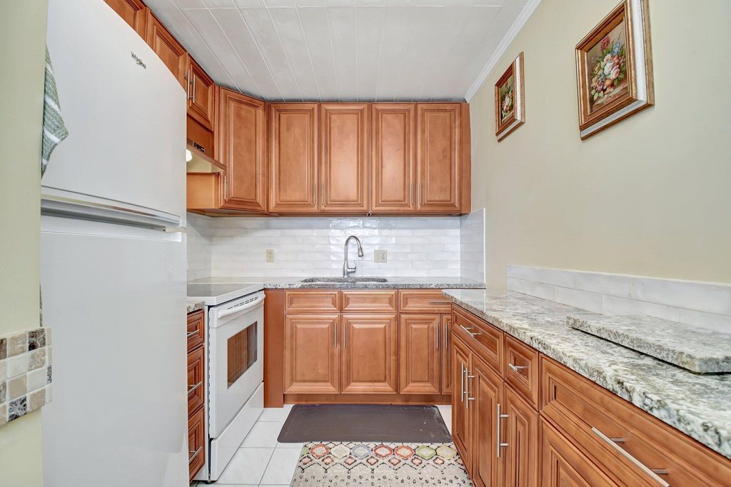 Photo of 400 Village Green Circle W #212, Palm Springs, FL 33461 (MLS # R11073131)