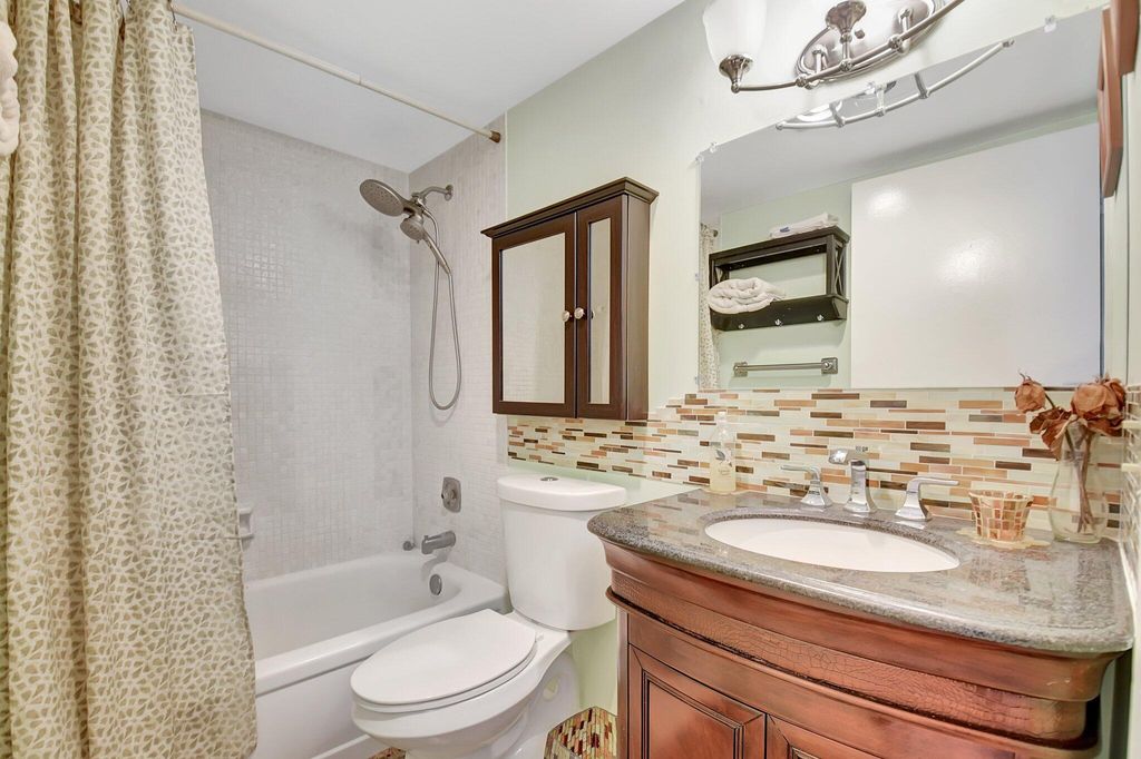 Photo of 400 Village Green Circle W #212, Palm Springs, FL 33461 (MLS # R11073131)