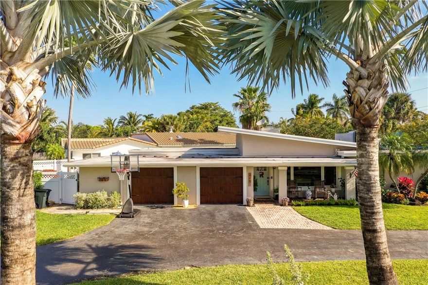 MID CENTURY MODERN STUNNER Open Wood Beam Vaulted Ceilings in Lighthouse Point Remodeled Kitchen Eat-in-Kitchen, Baths and Stunning 3rd Bonus Bath with Soaking Tub. Corner Lot w/ Dual Yards; Heat/Chill Pool/Patio/Cook-out Area & Artificial Turf/safe rubber mulch Playground! New/Newer Features: Elec Panels, Impact Glass, Custom Built-ins, Washer/Dryer, Wood Plank, Marble Floors, Double Wood Burning Fireplace, Additional Mini-Split A/C. Great Work from Home Space, Large Bedrooms with Walk-in-Closets, 2 En-suite Bedooms So Much to See & Love in this Home Located in a Small Town Lifestyle Loaded with Mature Tree Lined Streets, 18 Miles of Waterways, Library and City Police Dept. Within Walking Distance to Exchange Club Park, full service LHP Marina Minutes from the Inlet, Tennis Center.