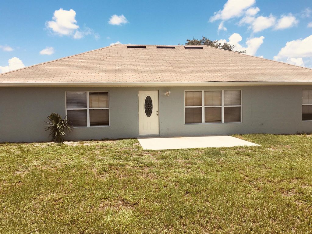 Photo of 1044 SW Ingrassina Avenue, Port Saint Lucie, FL 34953 (MLS # R11099657)