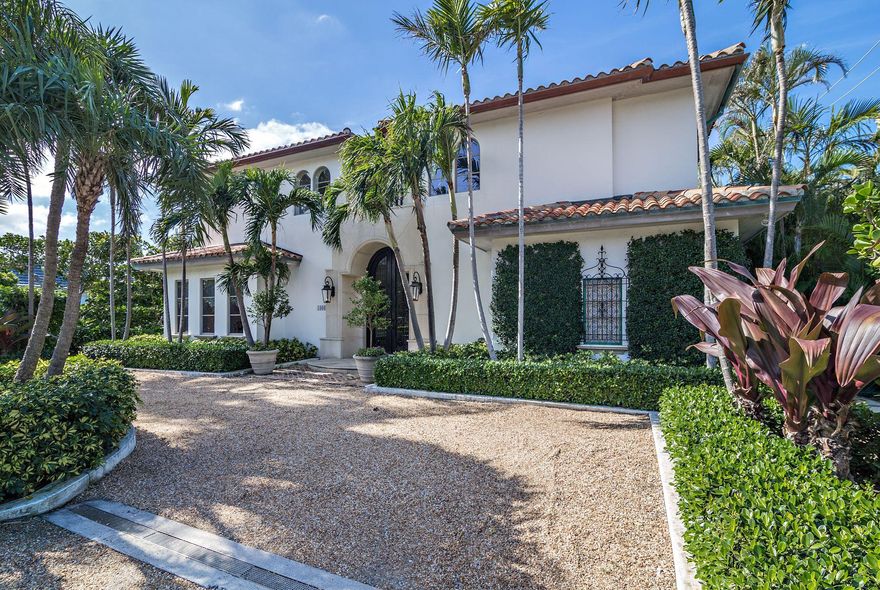 Palm Beach Mediterranean style residence. High ceilings, detailed finishes and impact windows throughout. Sparkling pool, beautifully manicured landscaping and covered loggia. Large living room, family room, gourmet kitchen, breakfast area, dining room and library with full bath. Spacious master suite with two marble baths and two walk-in closets. Two additional guest suites with full baths. Two car garage. This home is sophisticated, elegant and move in ready.