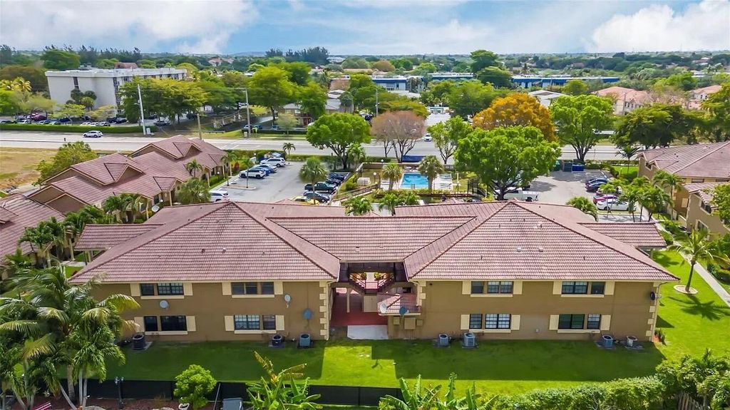 Photo of 2646 Riverside Drive #2646, Coral Springs, FL 33065 (MLS # B26007520)