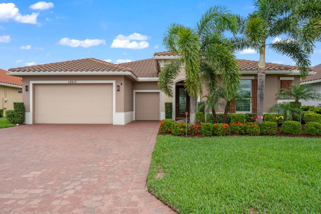 Photo of 12013 SW Marigold Avenue, Port Saint Lucie, FL 34987 (MLS # R10994695)